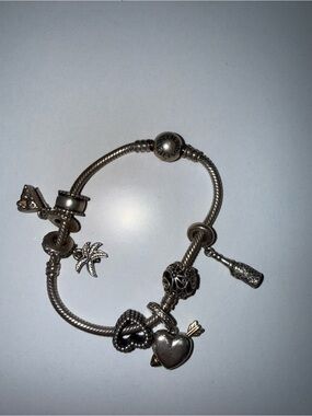 Pandora Silver Charm Bracelet-8 charms. Heart locket. Cake. Palm. Champagne
